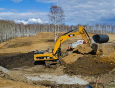 Работы по укладке металлических гофрированных труб.