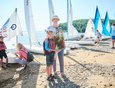 Кира Волчатова (2014 год рождения) — одна из самых юных участниц соревнований. Занимается парусным спортом недавно. На занятия привел папа. Обычно на тренировки водят родители, но на этой гонке Киру поддержала бабушка.