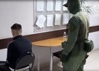Задержанный участник экстремистского движения. Скриншот видео пресс-службы СУ СКР по Иркутской области