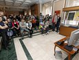 Гости выставки смотрят один из экспонатов выставки - мультфильмы, снятые молодыми авторами-иркутянами.